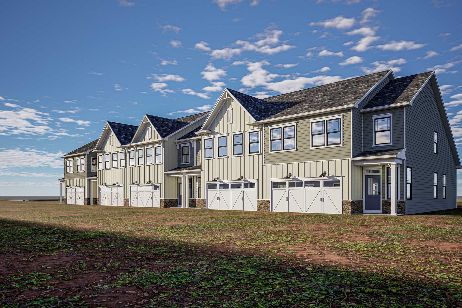 Two new two-storey homes finished in brick, render and stone cladding, seen from the street